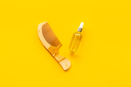 Herbal hair oil for treatment with wooden hair comb
