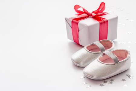 Baby girl pink shoes with gift box. Baby shower party setの写真素材