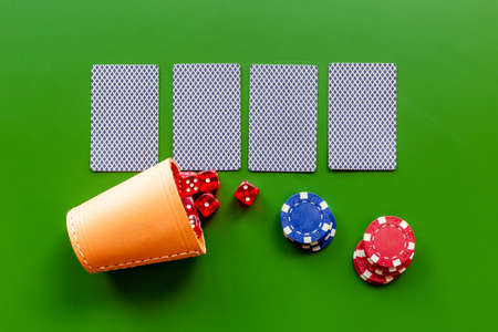 Poker table with gambling chips and playing card. Casino concept