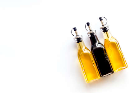 Balsamic and apple cider vinegar in glass bottles top viewの写真素材