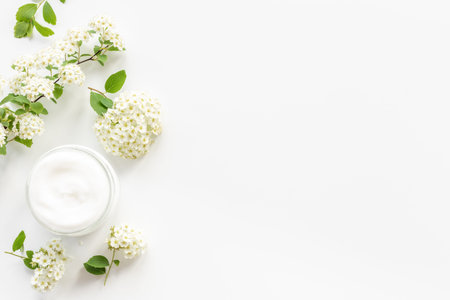 White spa medical herbal cosmetic with blossoms flowersの写真素材