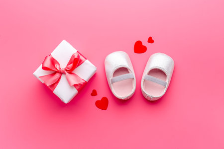 Baby girl pink shoes with gift box. Baby shower party setの写真素材