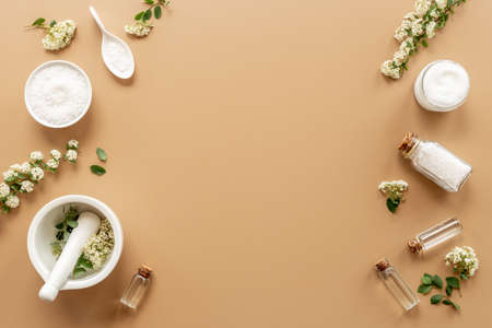 Set of white medical herbal cosmetics for skin care and beauty treatment with flowersの写真素材