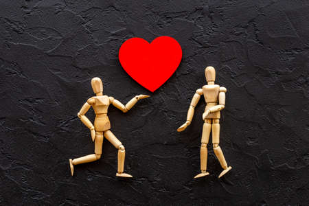 Couple of wooden mannequin figures with heart. Love and dating conceptの写真素材