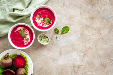 Beet soup with sour cream and fresh beet roots. Top viewの写真素材