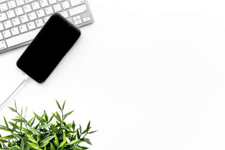 Usb cable for charging mobile phone and computer on office tableの写真素材