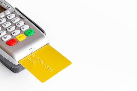 Pos payment terminal with credit card. Paying for shopping. E-commerce and businessの写真素材
