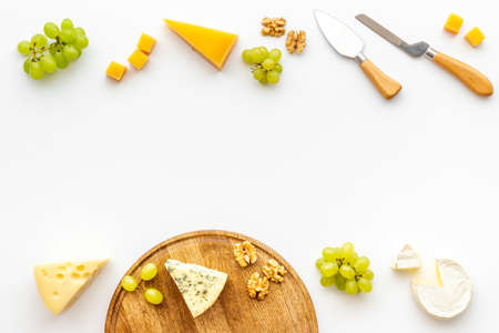 Various types of cheese with cheese knives. Snacks for wineの写真素材