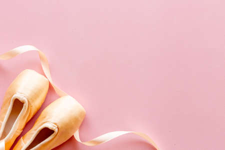 Pastel beige ballet pointe shoes or slippers with ribbonの写真素材