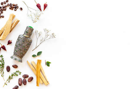 Arabian oud oil perfume with ingredients spices and fruitsの写真素材
