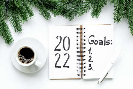 Goals 2022 - New Year plan, text in notebook. Top view, flat layの写真素材