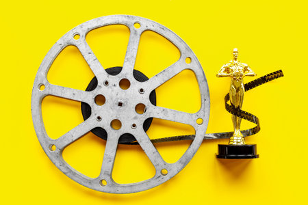 Film reel video tape with golden award statue