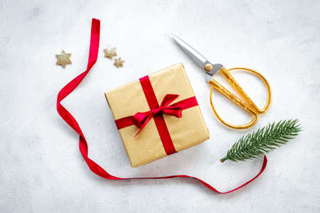 Christmas gifts background - golden gift boxes with red ribbonの写真素材