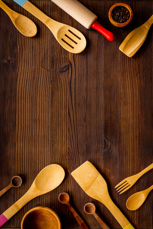 Flat lay of wooden kitchen utensils and cookwareの写真素材