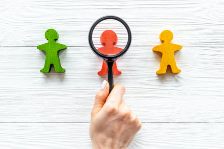 Wooden human figures - mediator arbitrator conflict resolving