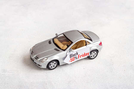 Sale of cars. Price sale label with small car modelの写真素材