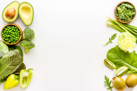 Raw green variety vegetables and herbs top view. Ready to eat vegetarian and vegan foodの写真素材