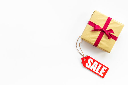 Sale label tag with gift box. Discount shopping day concept