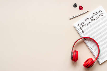 Sheets with music notes and headphones. Compose music conceptの写真素材