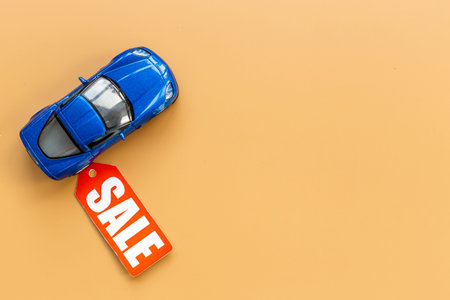 Sale label with small car model - sale of cars conceptの写真素材