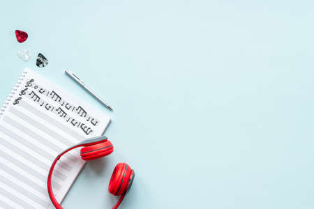 Sheets with music notes and headphones. Compose music conceptの写真素材