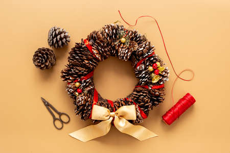 Process of making a Christmas wreath with with fir tree, ribbon and decorationの写真素材