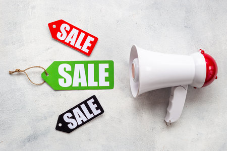 Sales announcement concept with sale labels and megaphoneの写真素材