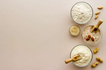Gluten free flour for baking - nuts and grains flour in many bowlsの写真素材
