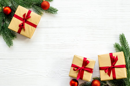 Christmas golden gift boxes with red ribbon and xmas tree