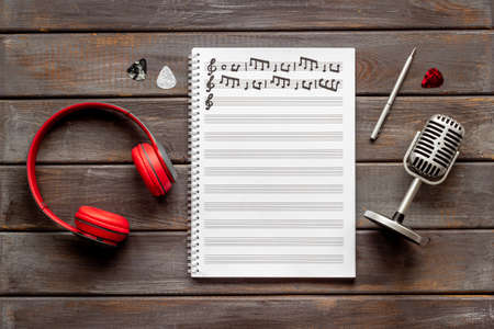 Music sheets with musical notes and microphone, top viewの写真素材