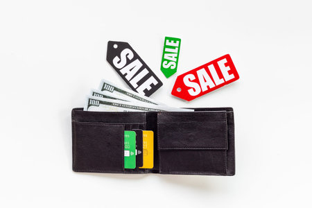 Discount shopping day - sale tag and wallet with banknotes and bank cardsの写真素材