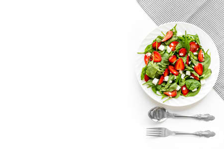 Healthy spinach salad with strawberry. Vegetarian lunchの写真素材