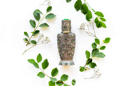 Silver bottle of arabian oud perfume or agar wood oilの写真素材