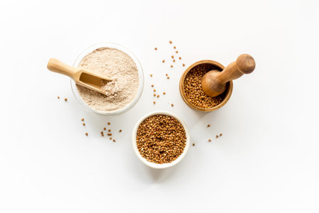 Pestle buckwheat flour - grains with mortar on kitchen table