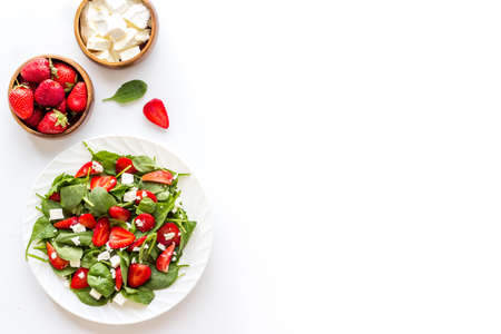 Vegetarian diet - green spinach salad with strawberry and goat cheeseの写真素材