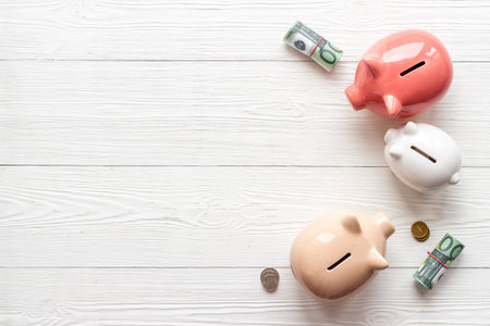 Piggy banks with coins. Currency saving and investments conceptの写真素材
