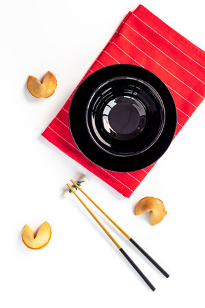 Fortune cookies and golden chopsticks. Asian style tabble settingの写真素材