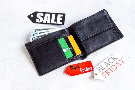Discount shopping day - sale tag and wallet with banknotes and bank cards