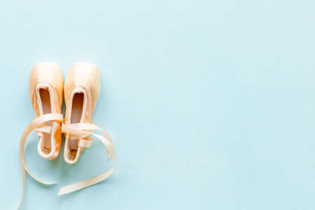 Pastel beige ballet pointe shoes or slippers with ribbonの写真素材