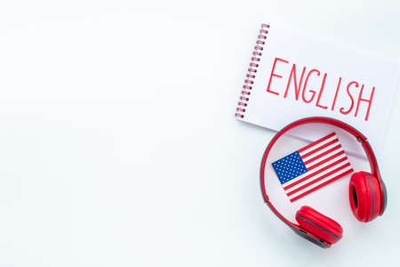 E-learning English language courses. Headphones on student table deskの写真素材