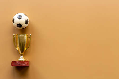 Golden trophy cup with sport game ball. Championship winner conceptの写真素材