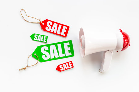 Sale announcement. Megaphone with price sale labels