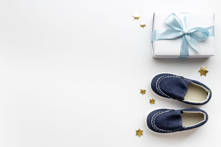 Baby boy blue shoes with gift box. Baby shower party set