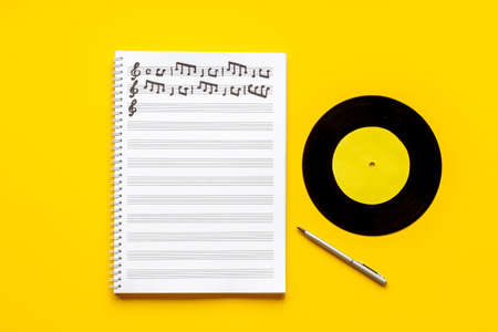 Music sheets with musical notes melody and vinyl recordの写真素材