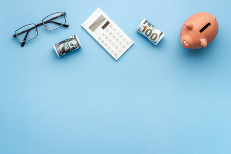 Money investments concept. Piggy bank with money and calculatorの写真素材