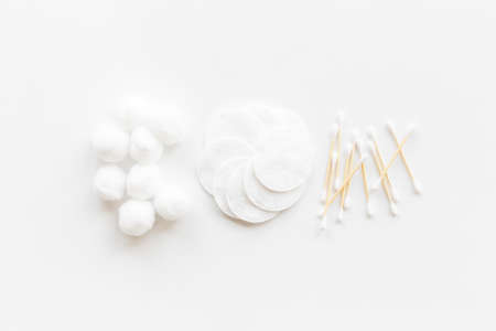 Cotton cosmetic makeup supplies - balls with cotton pads, top viewの写真素材