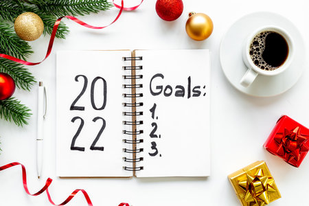 Goals New Year Resolutions concept - word on notebook, top view