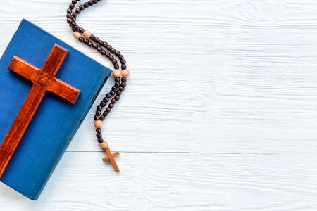 Rosary beads with cross on Bible book. Faith and prayer conceptの写真素材