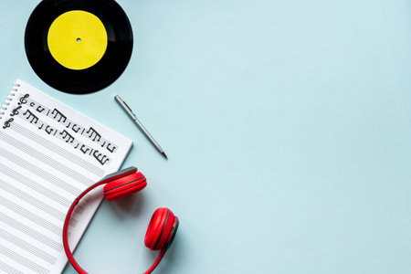 Handwritten music sheets and headphones, top view. Compose music conceptの写真素材