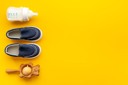 Baby newborn accessories with blue booties bottle of milk and toy